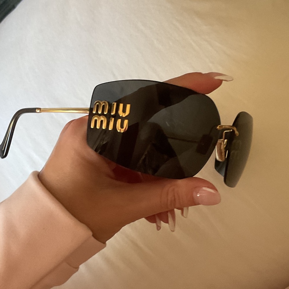 Miu Miu Black and Gold Sunglasses comes w box and dust bag